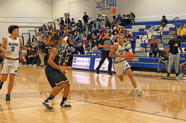 Darion Jones runs with basketball.