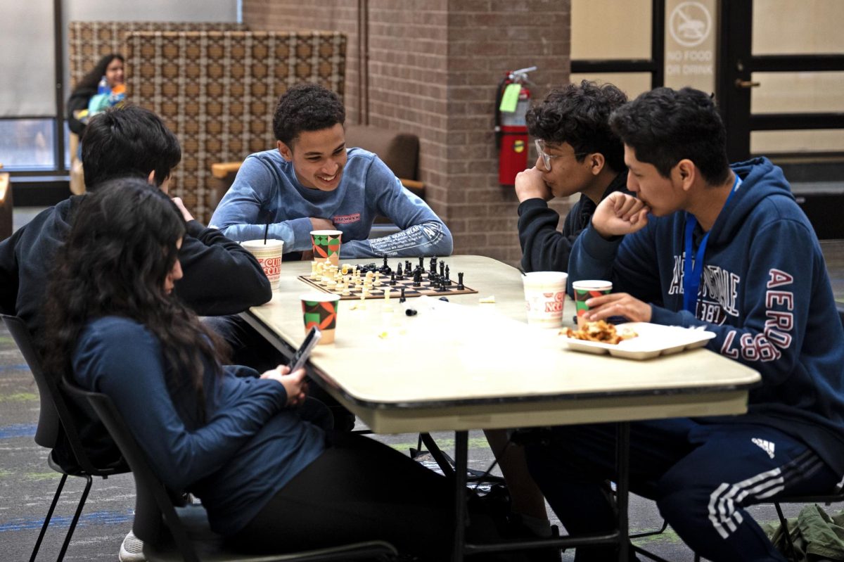 Students playing chess.
