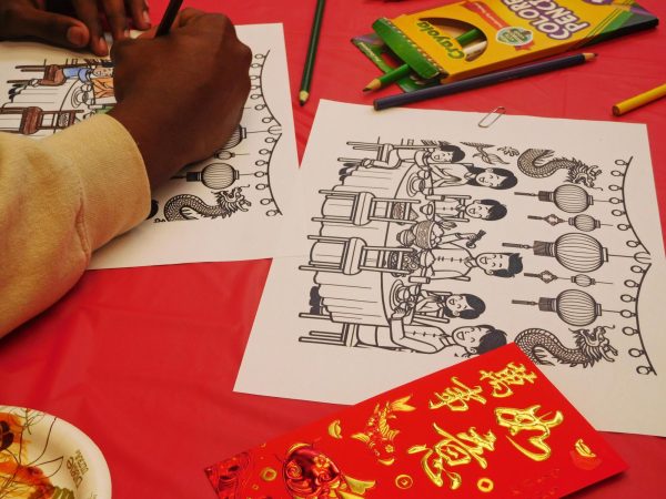 Coloring activities are laid on the tables for student to participated this event.