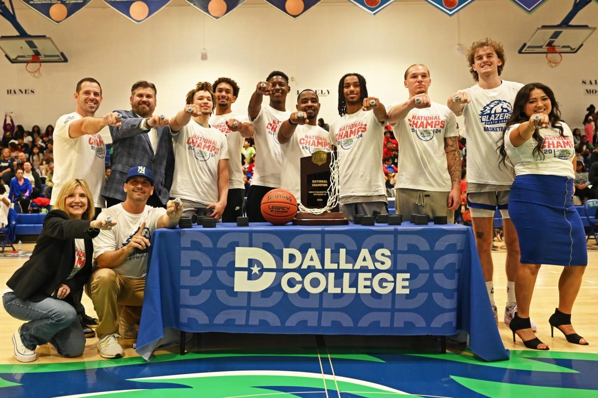 North Lake Blazers, coaches and administrators show off their championship rings. From left to right - Coach Josh
Mills, Chancellor Justin Lonon, Autavia Hobbs, Jermey Irwin, Jeremy Watkins, Coach Allen Smith, David Clower,
Josh Jackson, Anden Holmes, Coach Iesha Jackson, Dr. Christa Slejko, and Coach Greg Sommers.