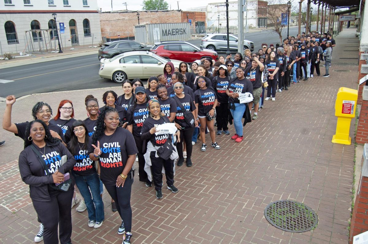 Dallas College students and employees showing off their Civil Rights Tour t-shirts. 