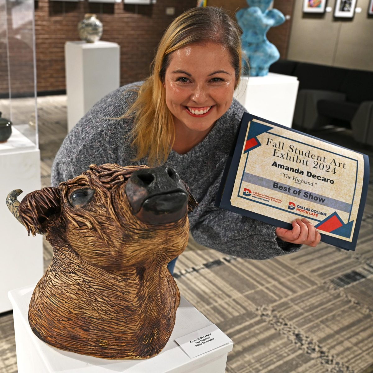 Amanda DeCesaro displays her sculpture The
Highland won Best of Show in the exhibit.