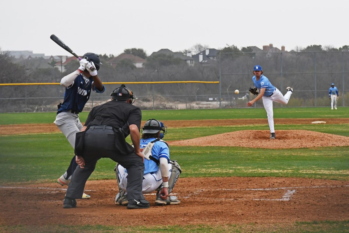 The Blazer’s left-handed pitcher Logan Walp (24) delivers a fastball.