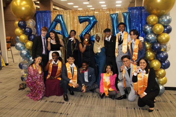 Outgoing and incoming officers of PTK - AZH chapter celebrate at their Induction
