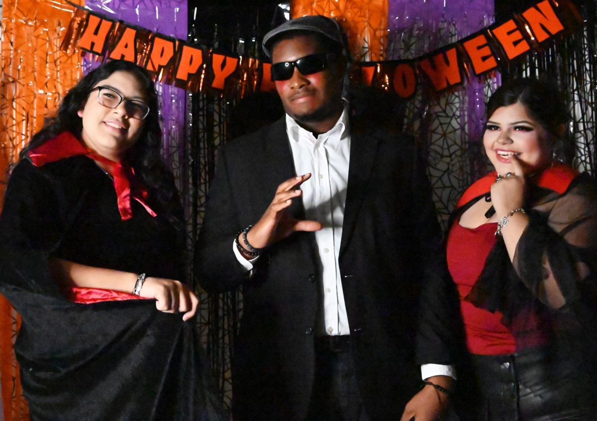 Dayanara Castelan, Olisamedua Isichel and Valeria Martinez strike a pose at the Halloween party. 