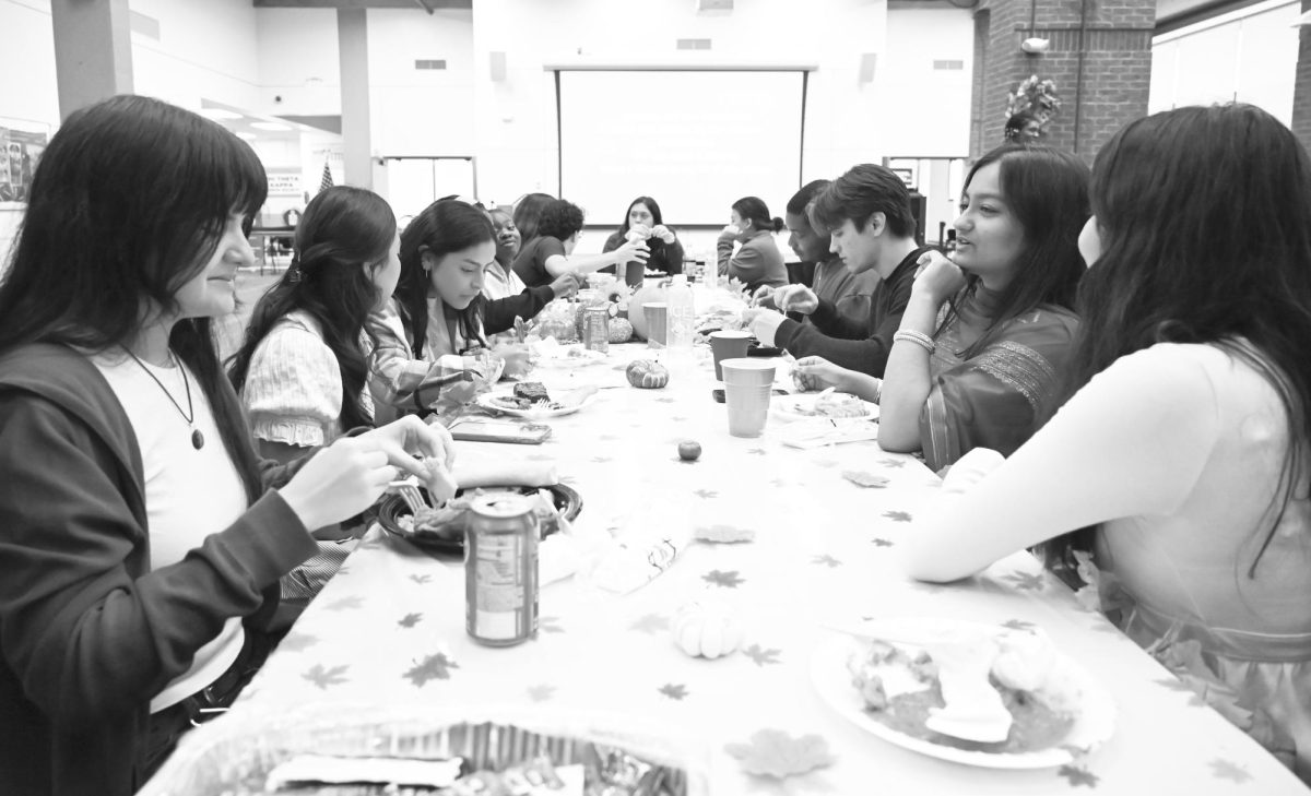Students gather around long tables to share the spirit of Friedsgiving.