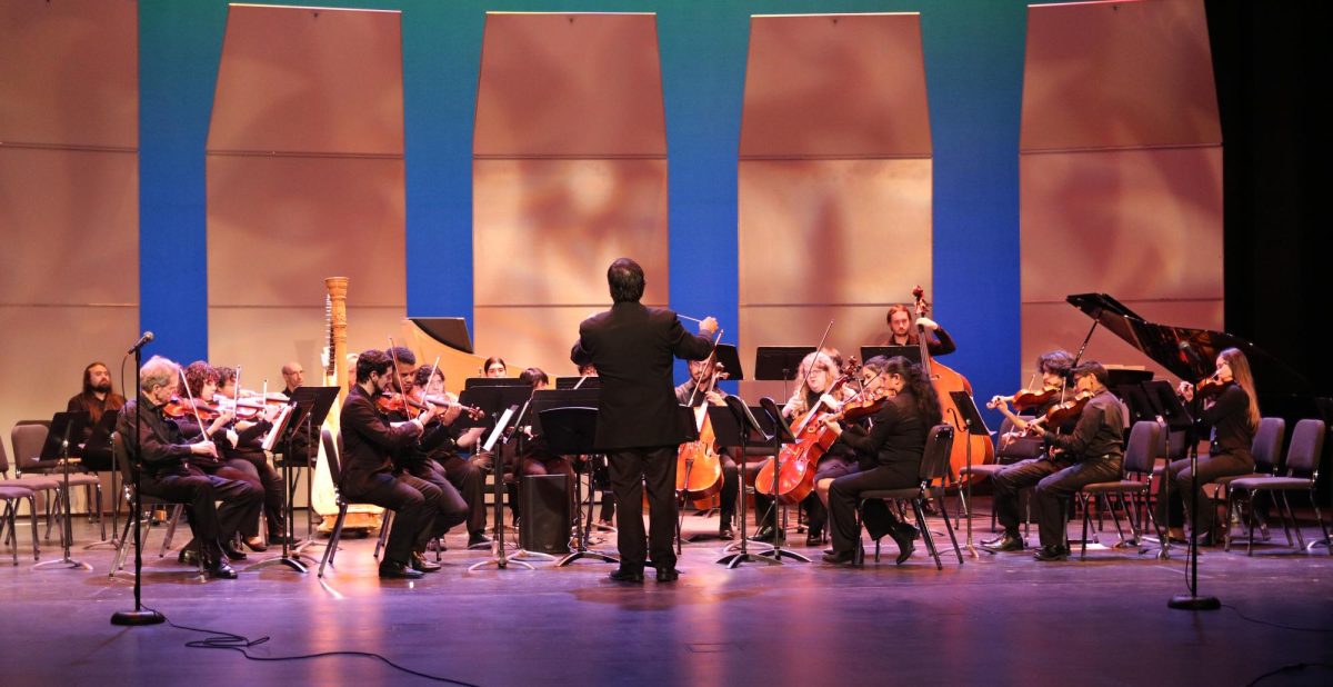 Dr. Abel Rodriguez conducts a piece by Brookhaven, Eastfield and Richland campuses at the Dallas College Orchestra and Chamber Concert.
