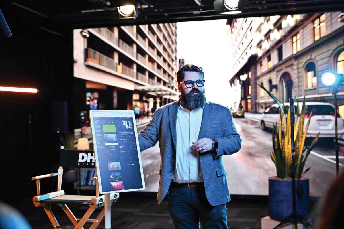 DHD Films Consultant, Ian Loomer, demonstrates the video wall which will create new employment opportunities for students and professional filmmakers in Texas.