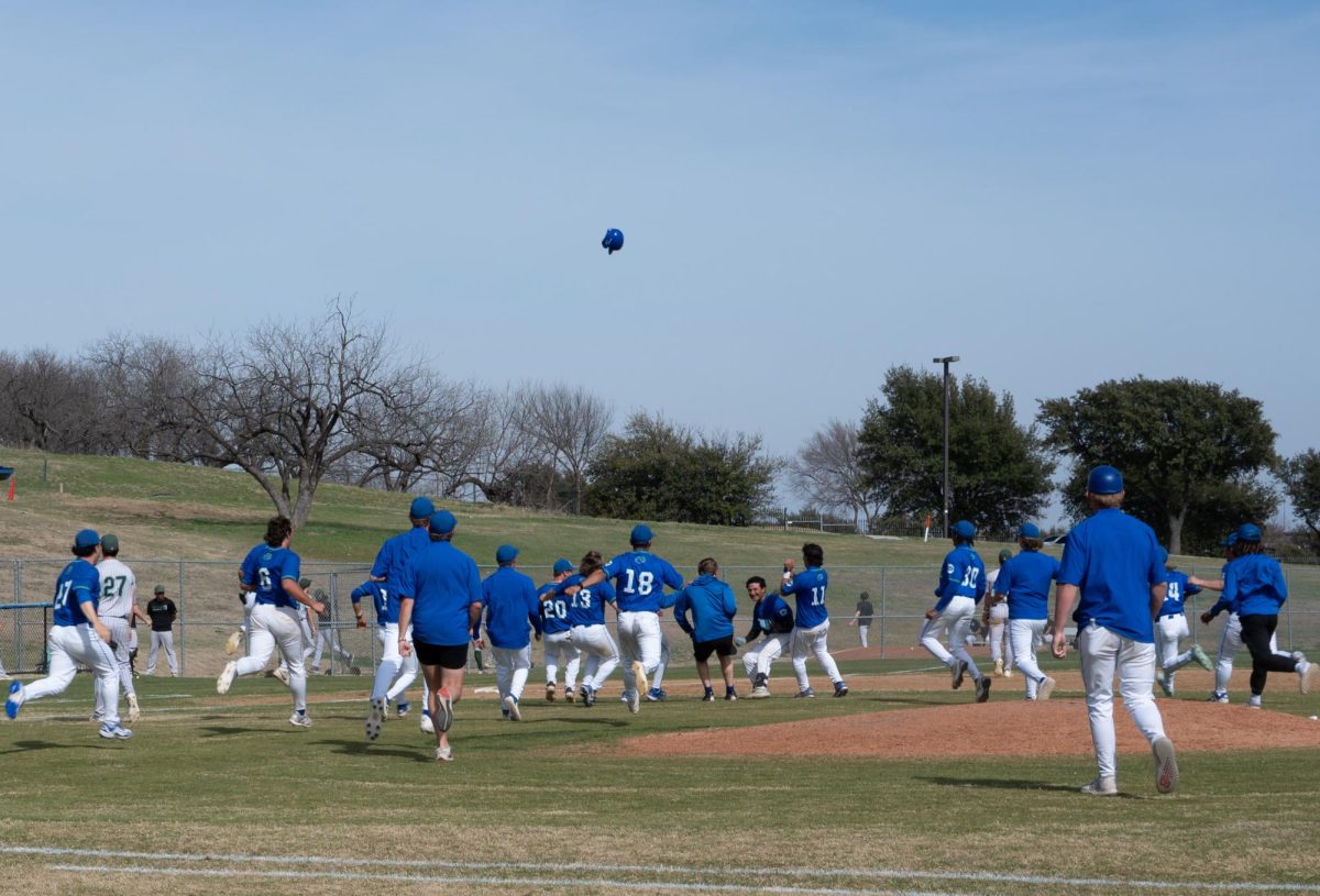 North Lake players rush the field while a helmet flies into the air to celebrate Salvador
De La Garza’s walk-off home run in the ninth inning against Brookhaven on Feb. 25.