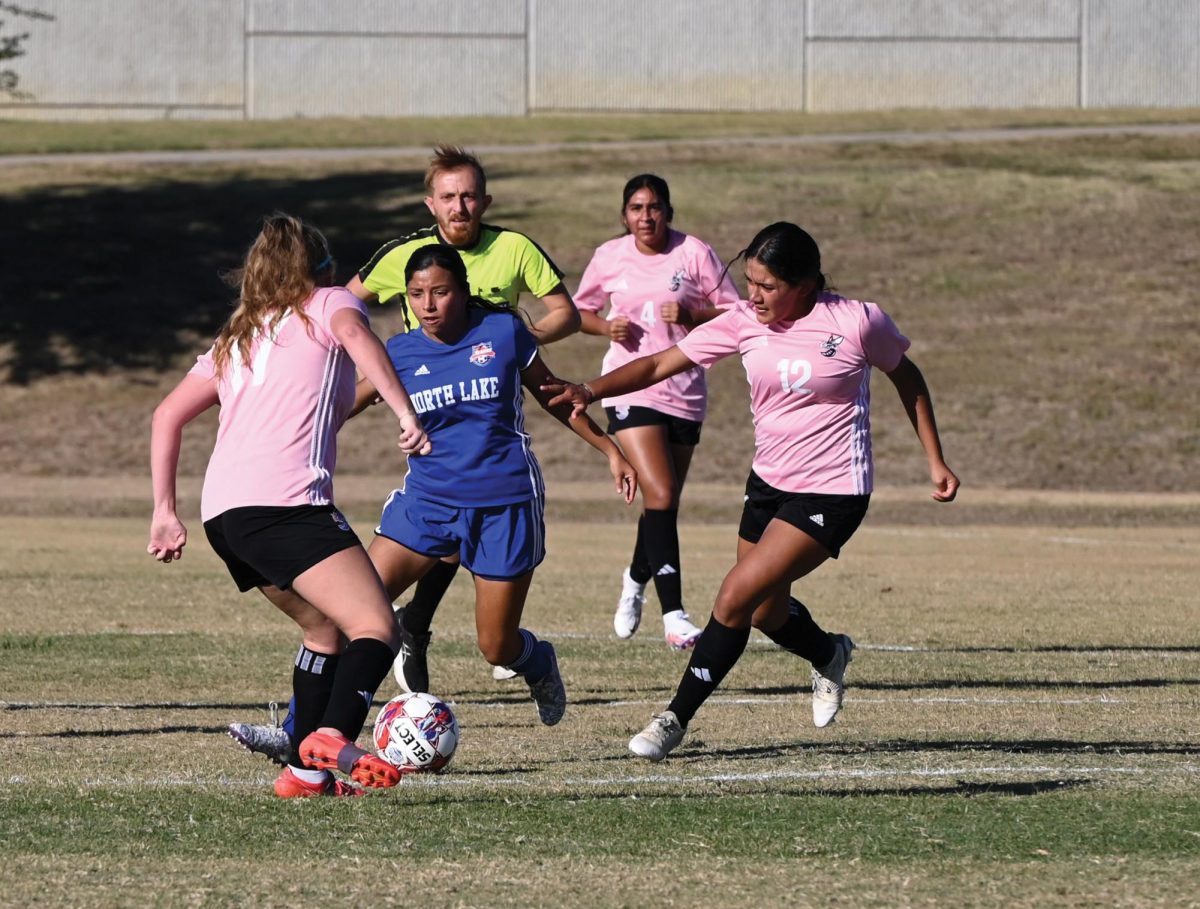 North Lake's Katherine Garcia fights for possession against Eastfield players She scored both goals in the Blazer's 1-2 win, securing their only conference victory of the year. 