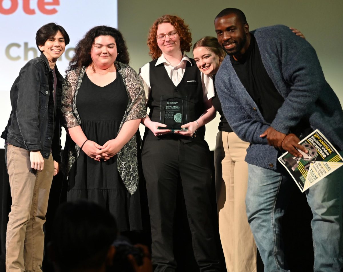 Jett Dinh, Melany Zarate, Sun Burns, Selah Grace and Henry Okigbo gather on stage to accept the Judges' Choice Award for the short film "Limbo" during the 27th annual North Lake Campus Student Video Showcase. 