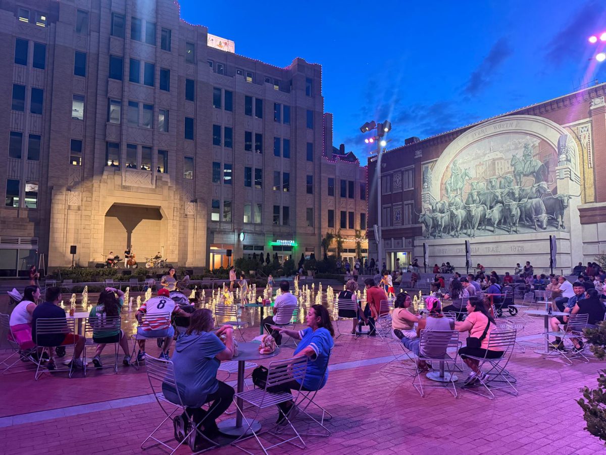 Sundance Square visitors enjoy live concert.
